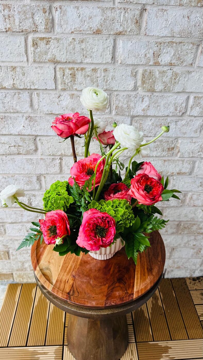 Purple roses with white lisianthus and bells of Ireland